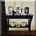 F04. Black lacquer sofa table. 34”h x 44”w x 17”d 